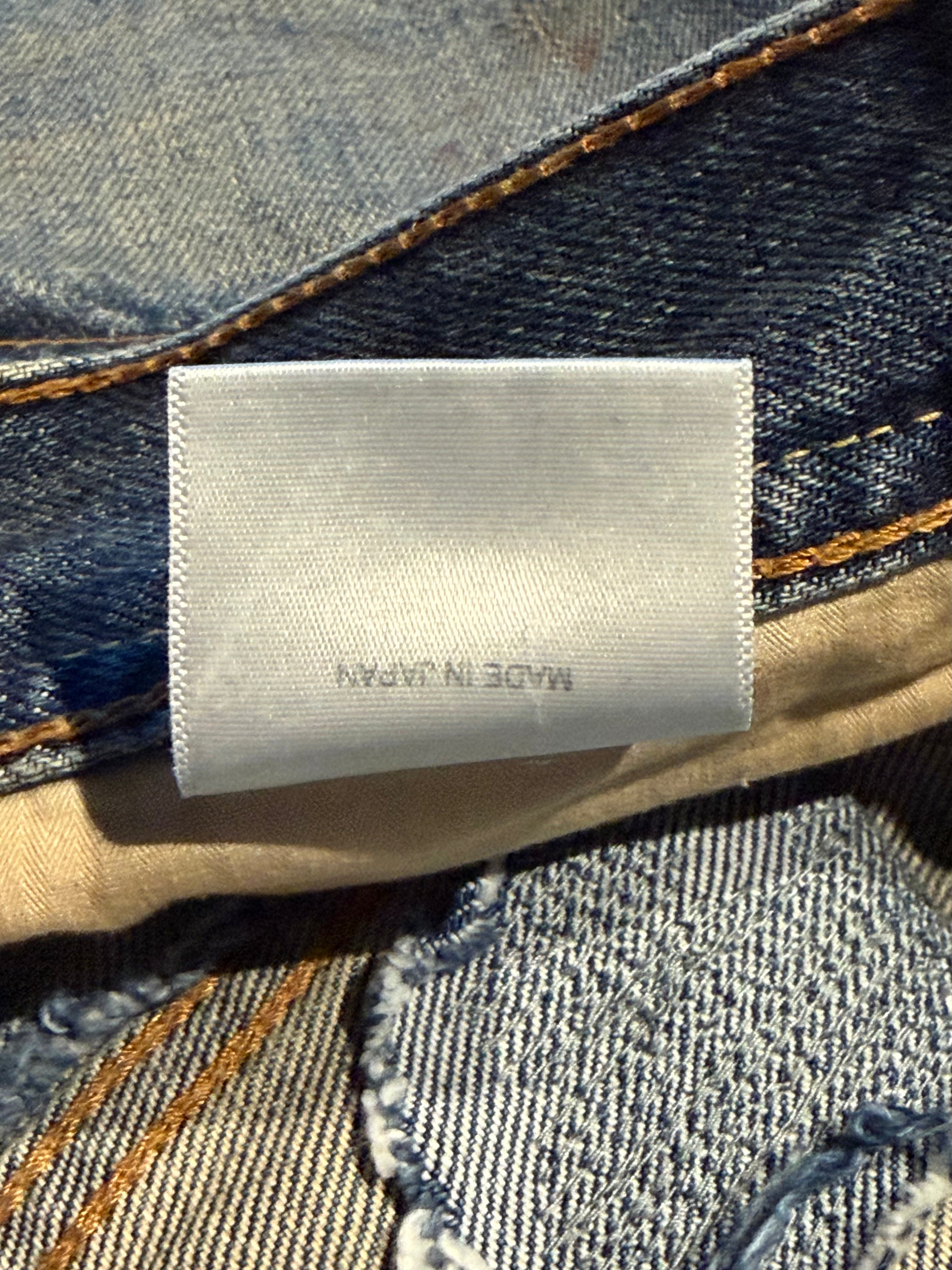 Logo Patch Distressed Denim Jeans